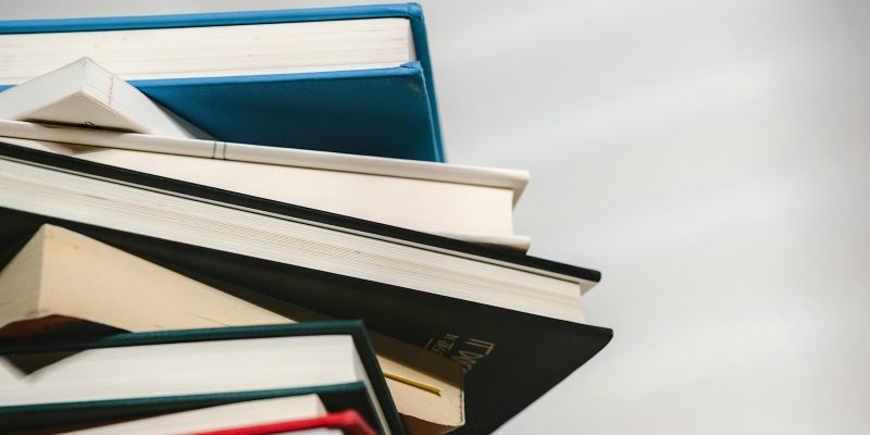a stack of books sitting on top of each other